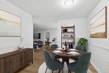 Dining area with round table and upholstered seating